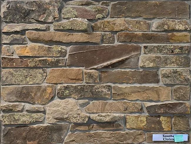 Stone wall with varied brown, tan, and gray colors and irregular shapes.