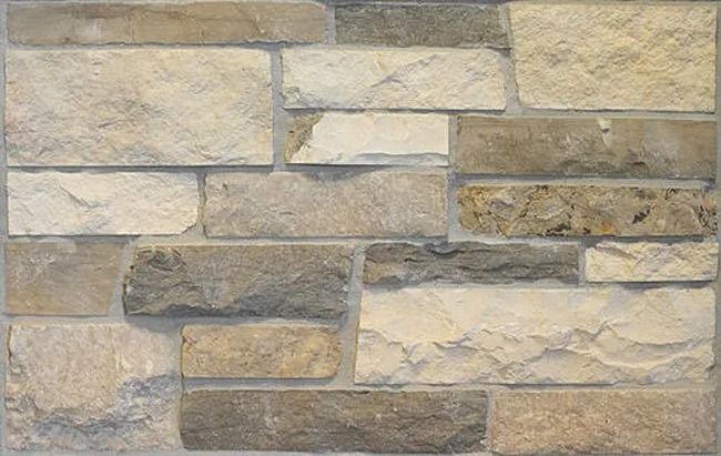 Stone wall with various beige, tan, and gray rectangular blocks.