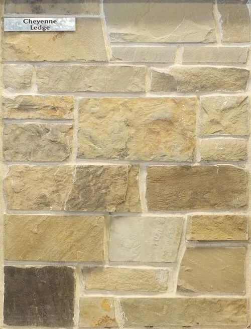 Stone veneer sample in various beige and brown tones with mortar, labeled