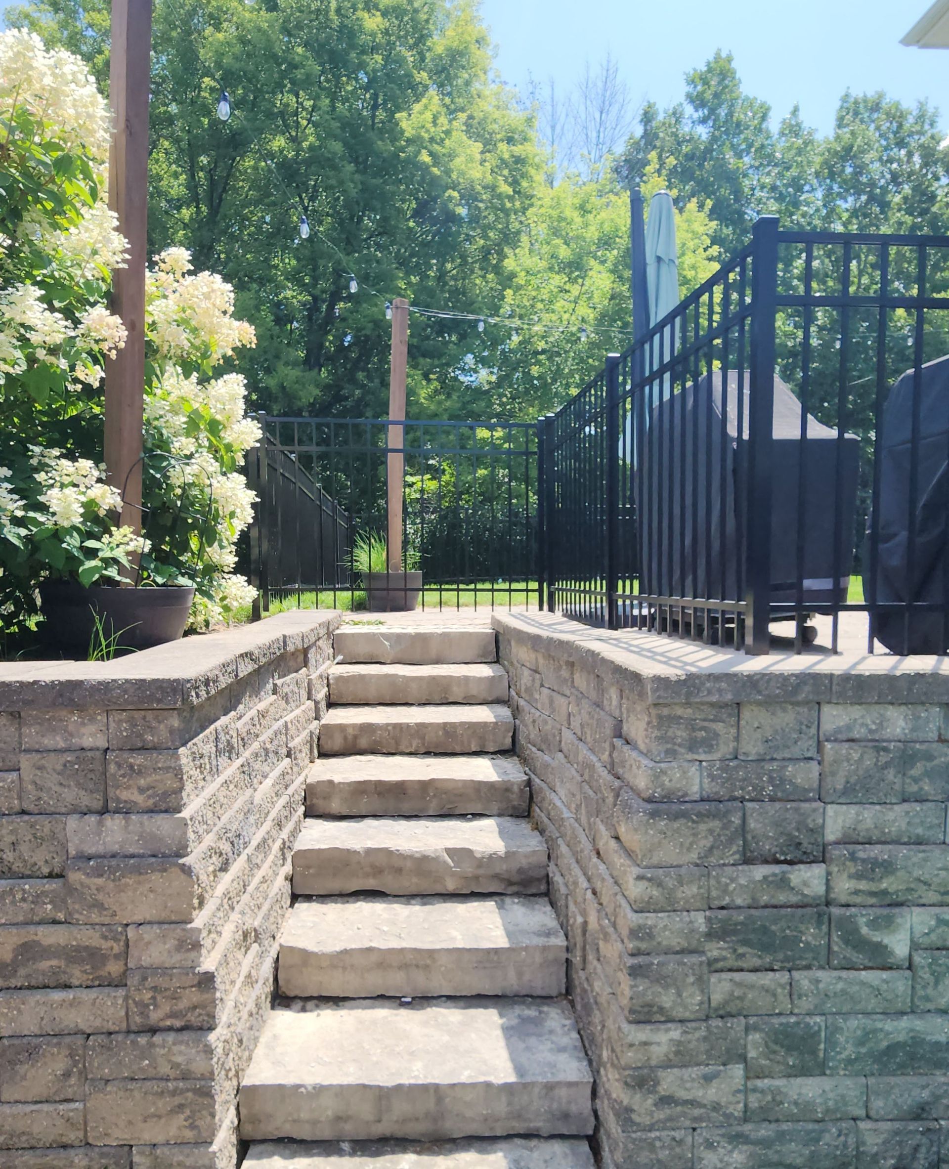 A set of stairs leading up to a fenced in area