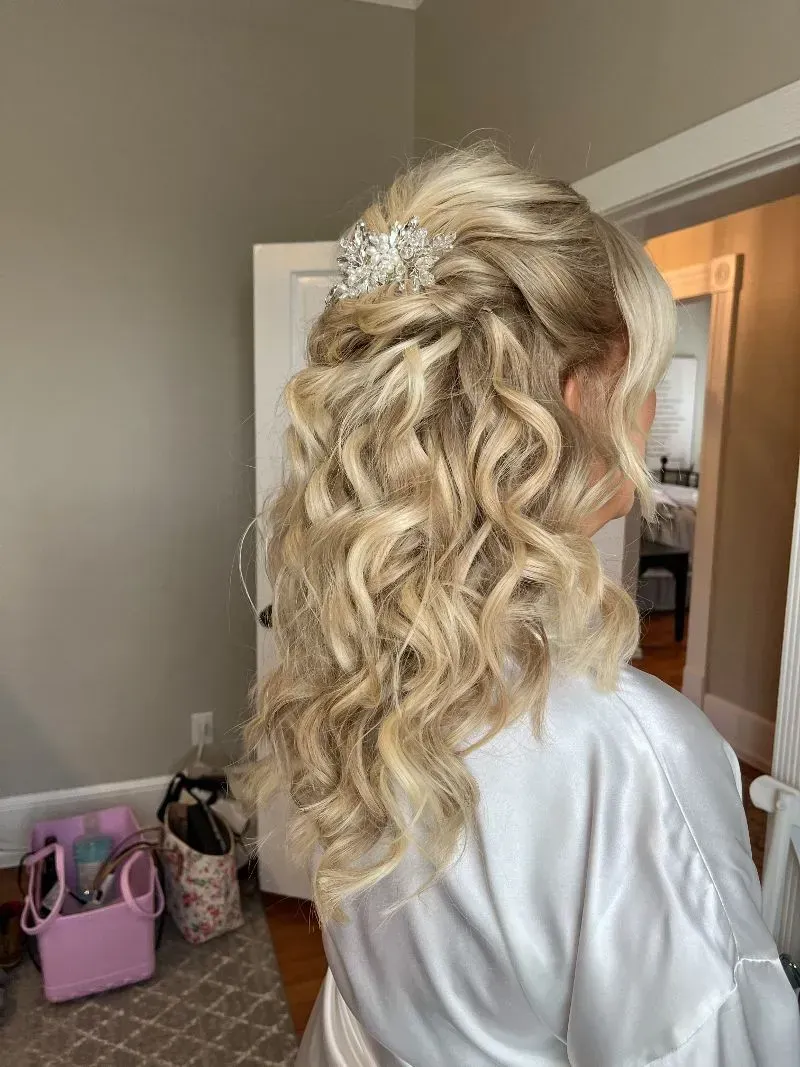 Blonde curly hairstyle shown from the back in a bedroom doorway