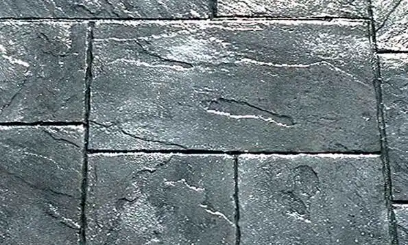 A close up of a gray tile floor
