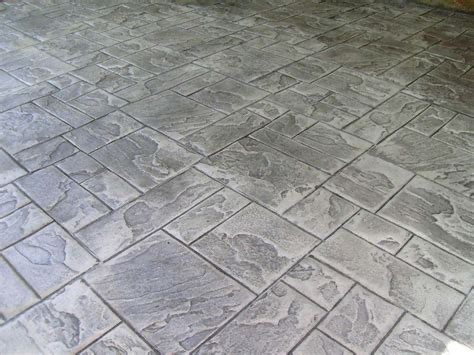 A close up of a concrete floor with a pattern of squares