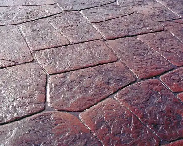 A close up of a brick floor with a diagonal pattern