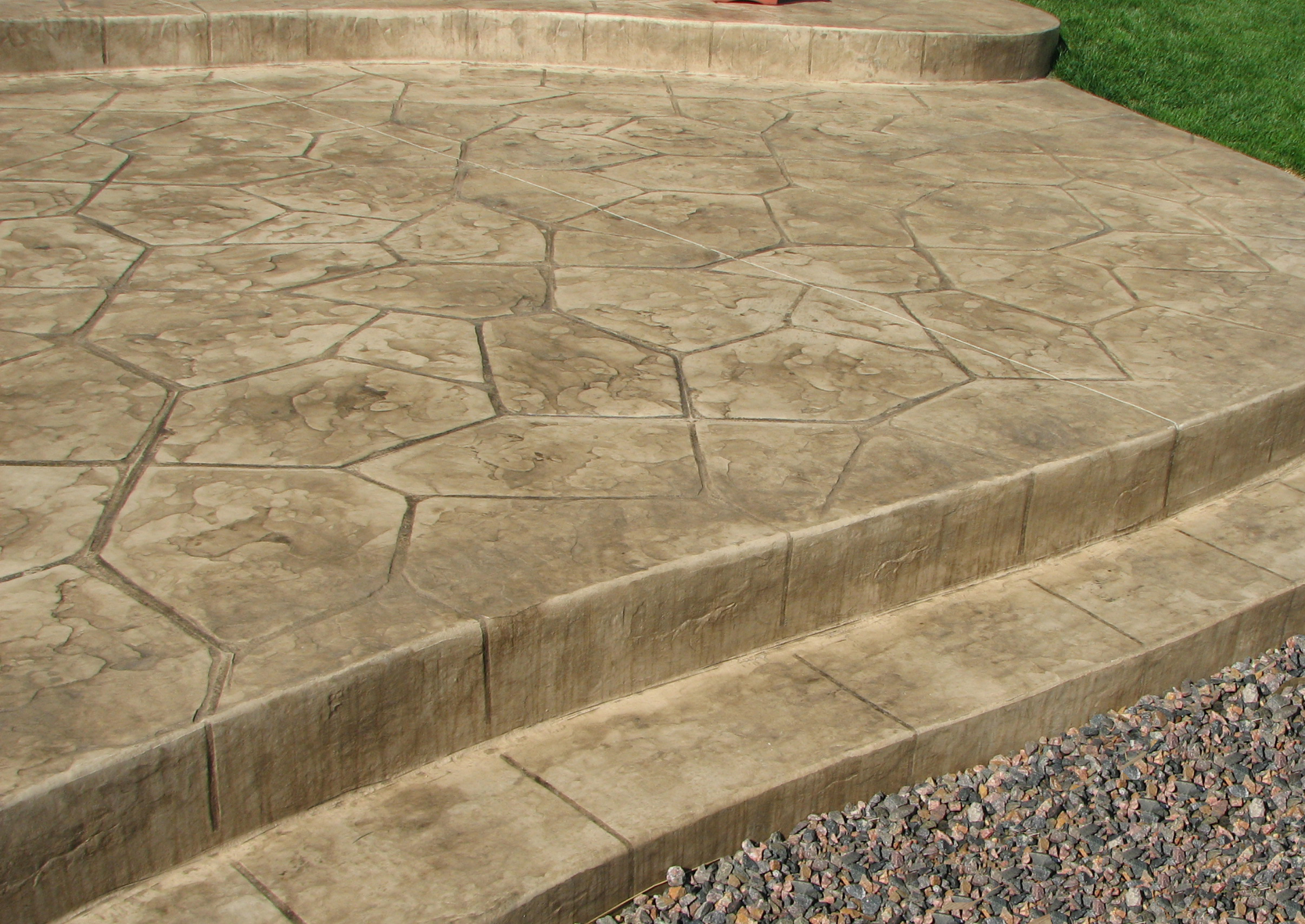 A concrete patio with stairs leading up to it