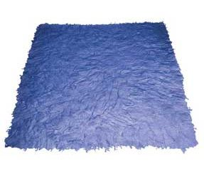 A blue rug is sitting on a white surface