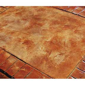 A close up of a concrete floor with a brick pattern