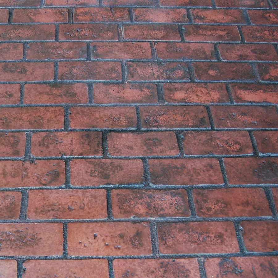 A close up of a brick floor with a lot of bricks