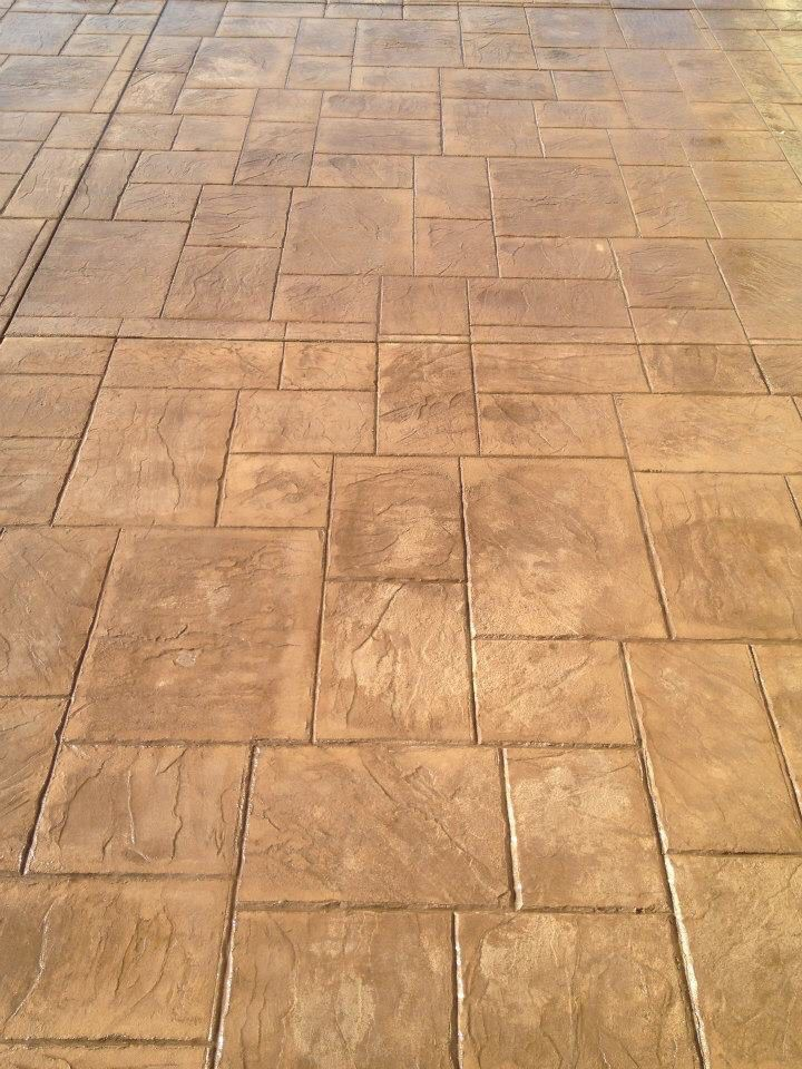 A close up of a brick floor with a geometric pattern
