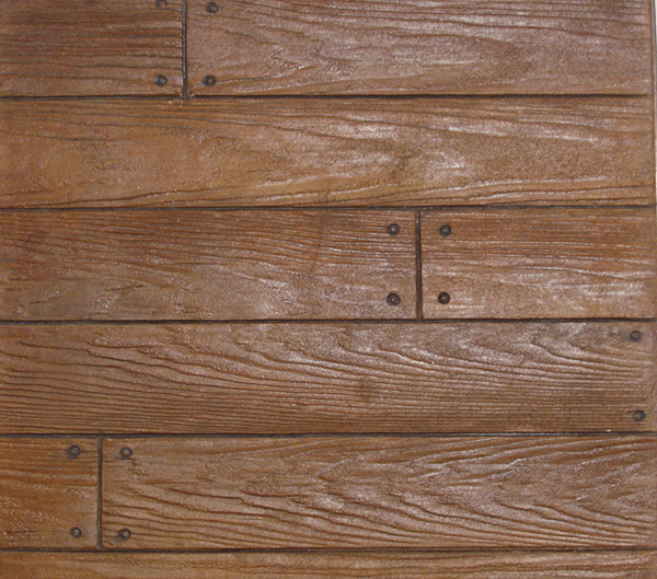 A close up of a wooden floor with nails in it