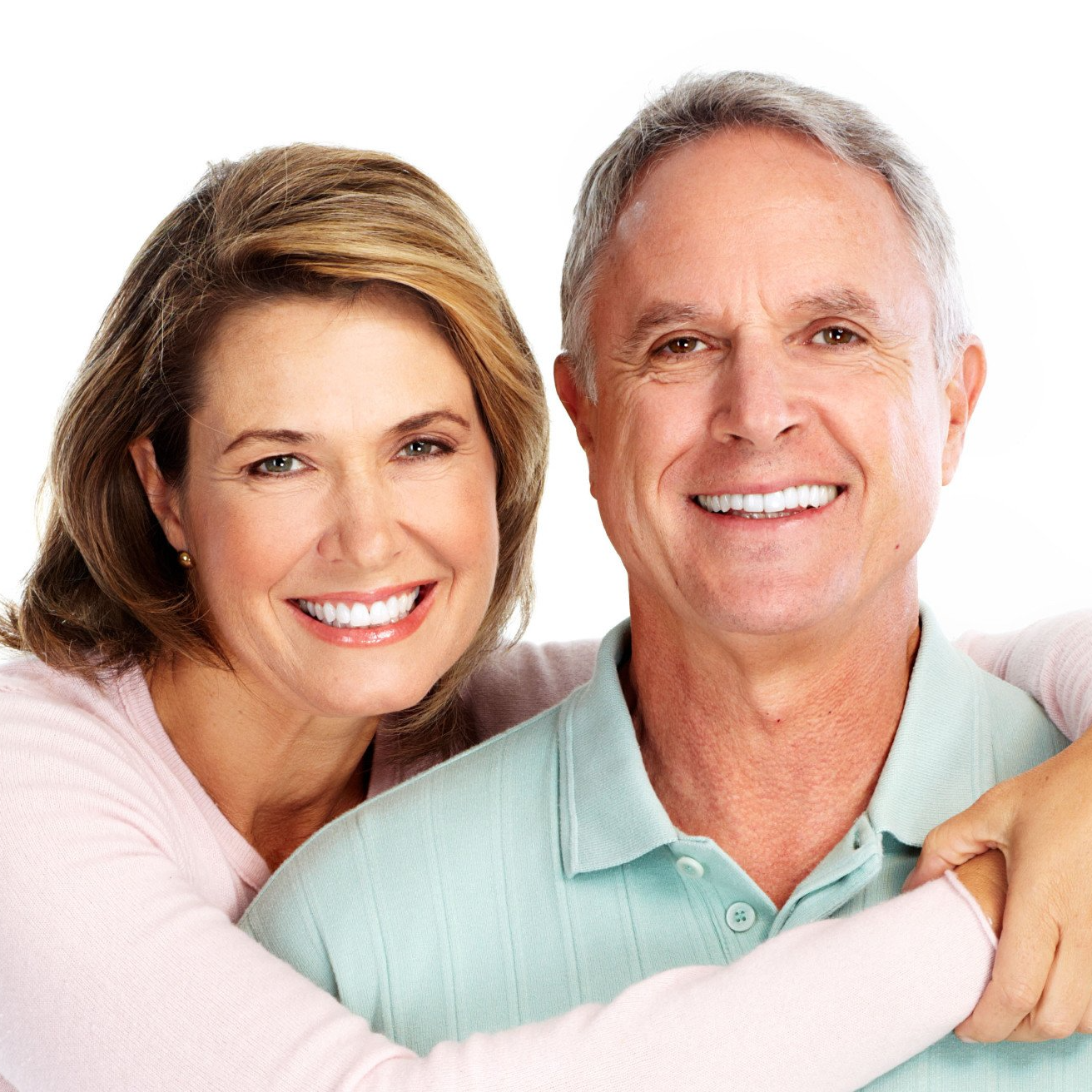 A man and woman are hugging and smiling for the camera