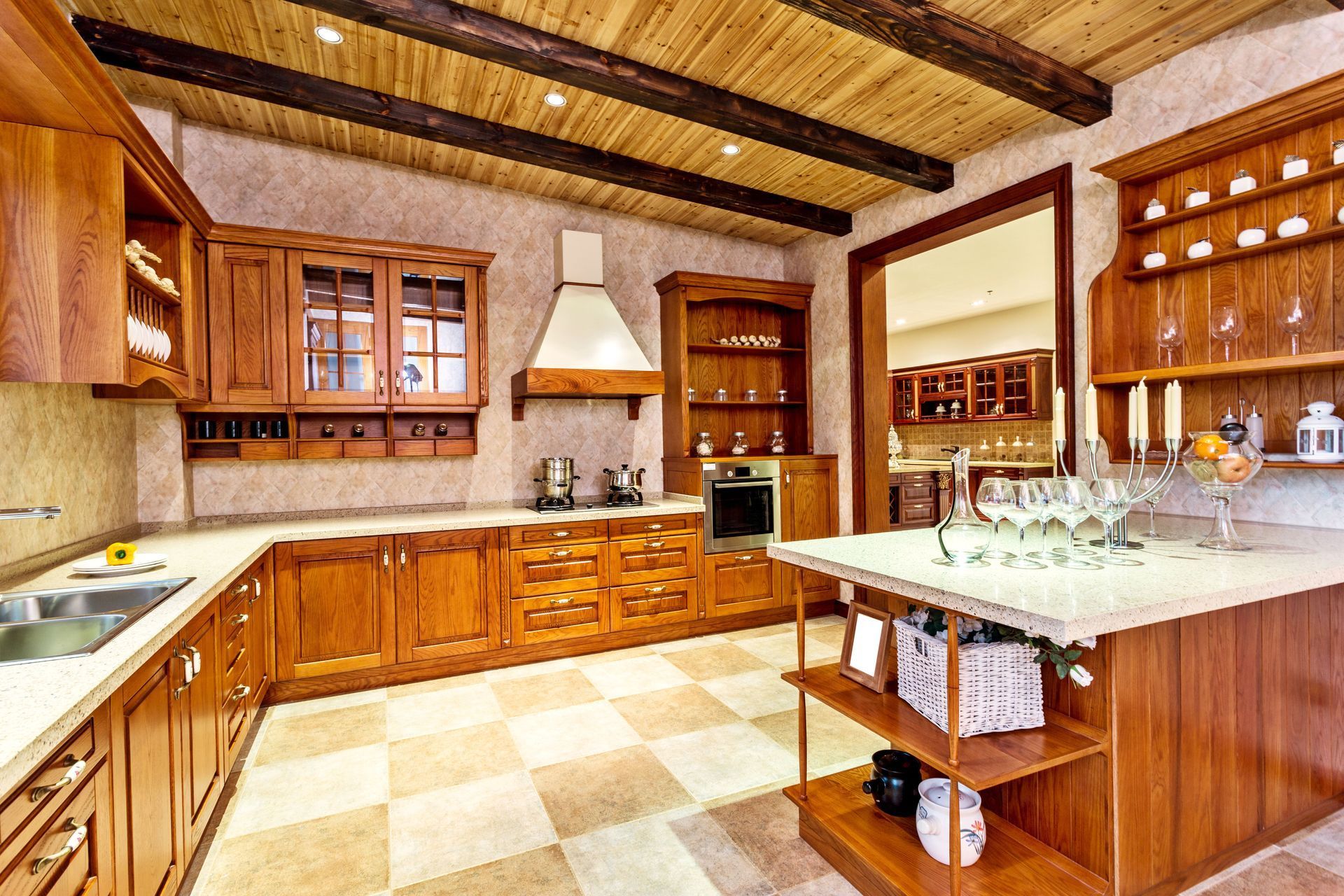 Wooden kitchen with cabinets, stove, and island. Beige and brown color scheme.