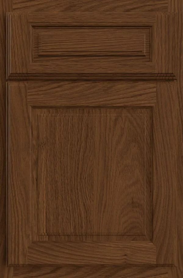 Wooden cabinet door with raised paneling in a warm brown tone.