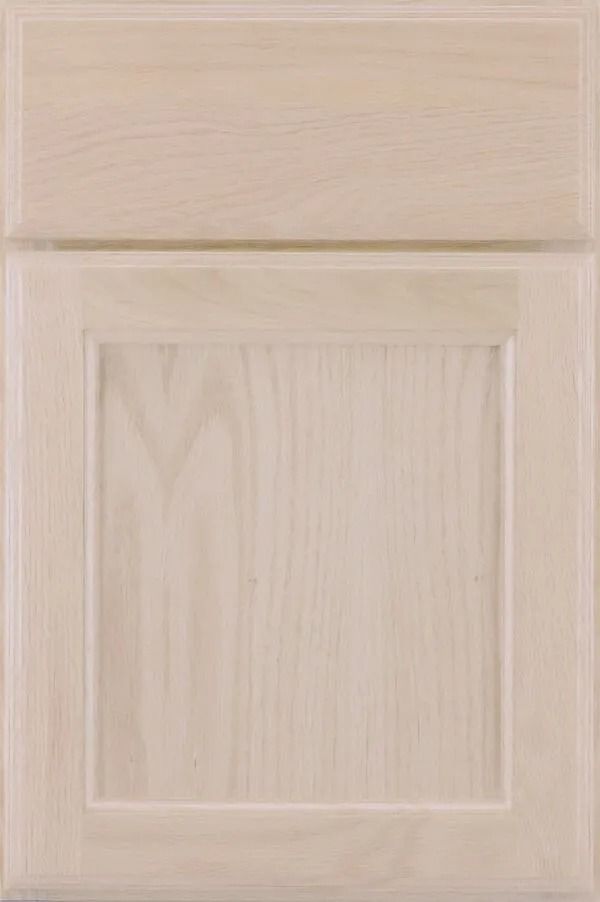 Light wood cabinet door with recessed panel.