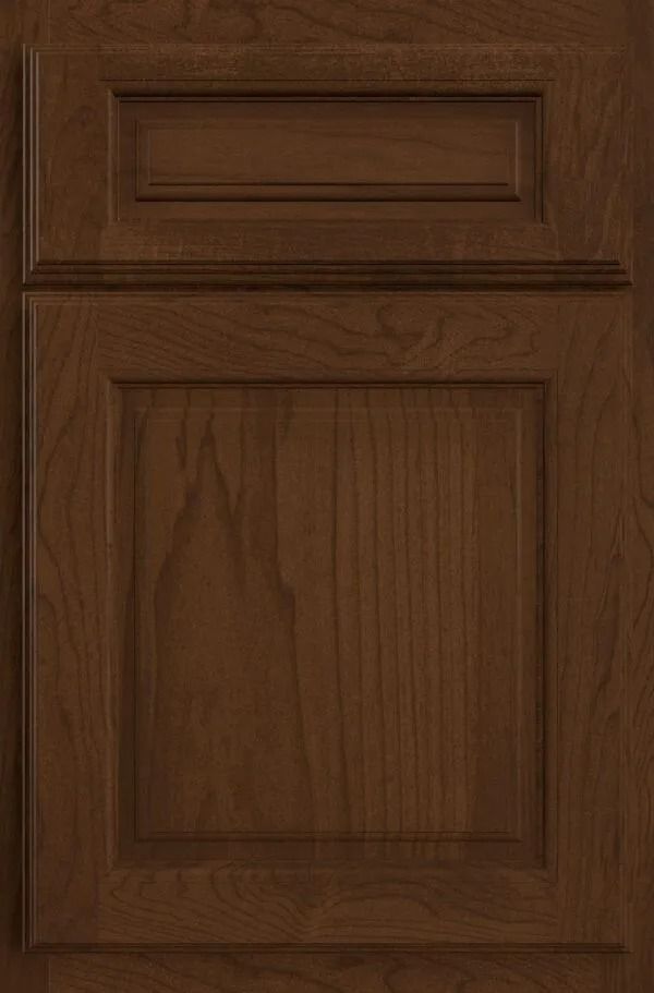 Brown wooden cabinet door with recessed paneling.