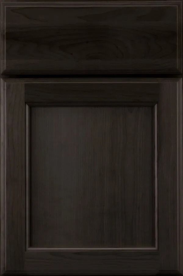 Dark stained wooden cabinet door with recessed panel.