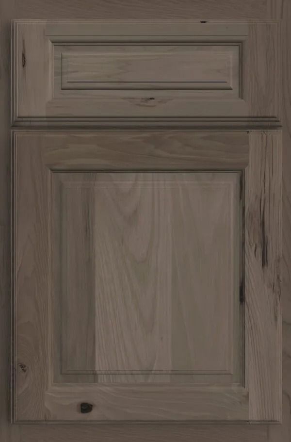 Wooden cabinet door with raised panel in a light brown-gray finish.