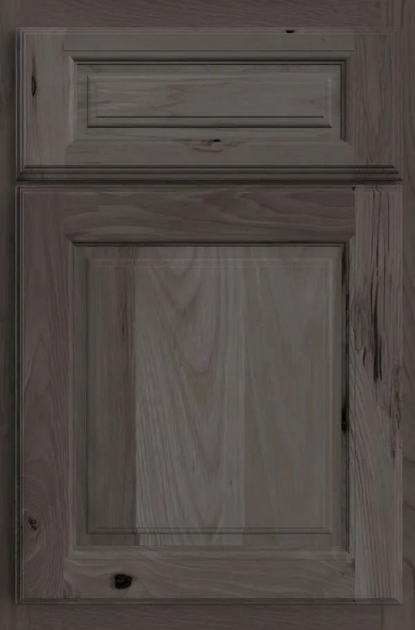 Gray-stained wooden cabinet door with raised panel and trim detail.