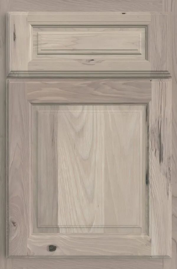 Light wood kitchen cabinet door with raised panel and top detail.