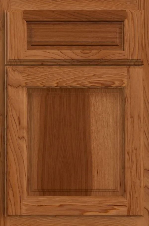 Wooden cabinet door with raised panel in a medium brown finish.
