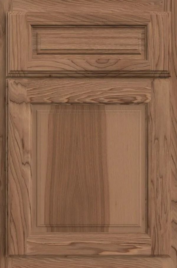 Wooden cabinet door with raised panel and rectangular top detail, stained brown.