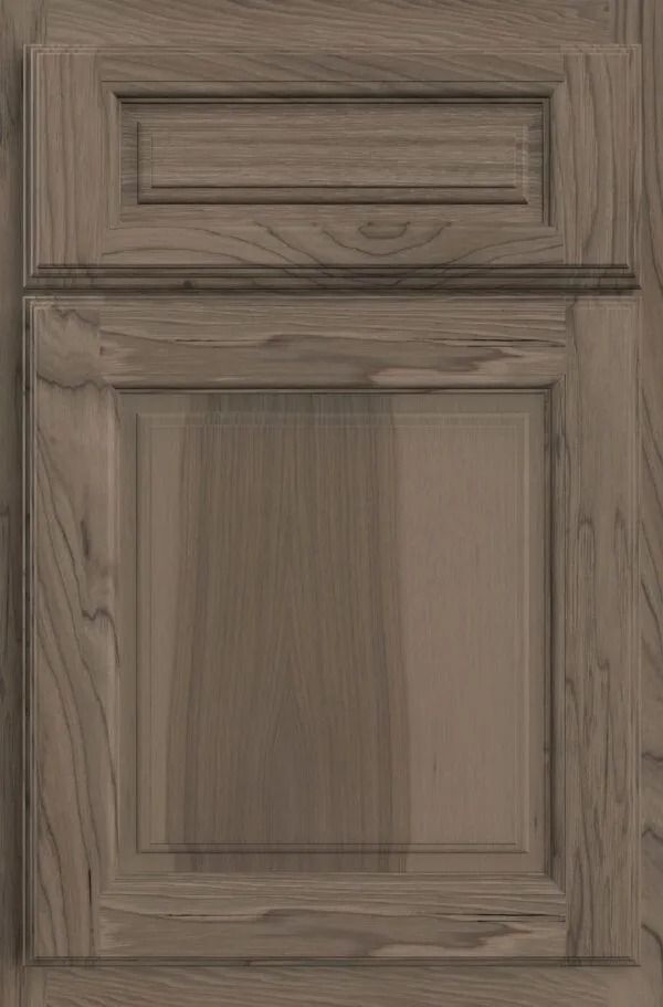 Wooden cabinet door with raised paneling in a warm brown tone.