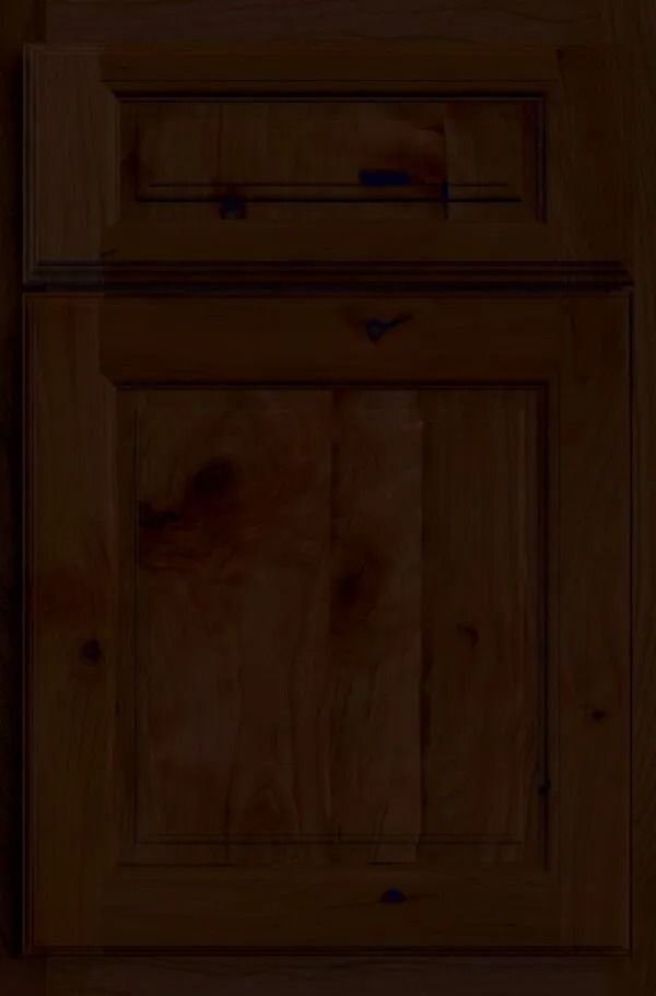 Wooden kitchen cabinet with raised panel door, stained brown.