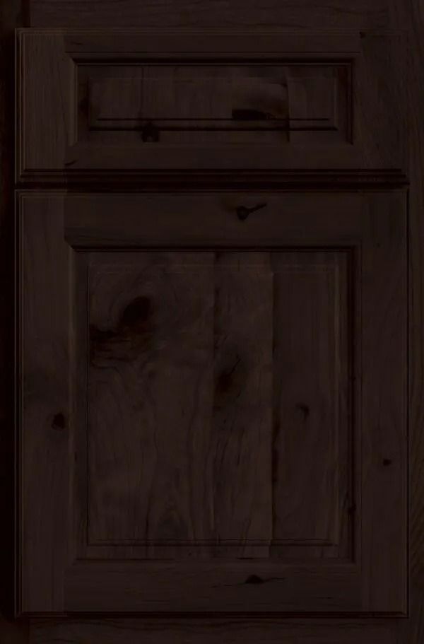 Dark stained wooden cabinet door.