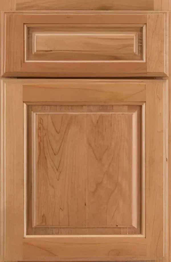 Light brown wooden cabinet door with a raised panel.