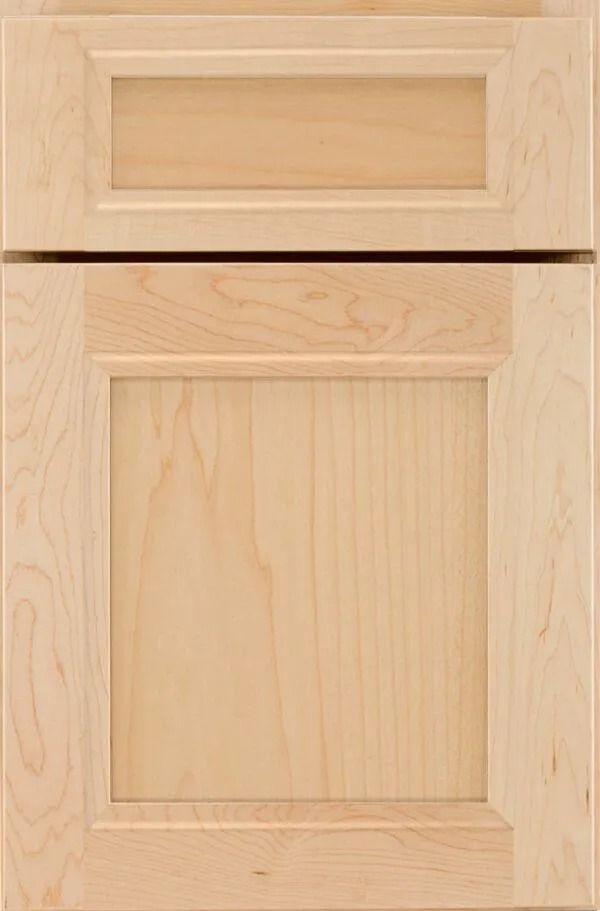 Close-up of two light-colored wooden cabinet doors, one above the other, showing raised panel design.