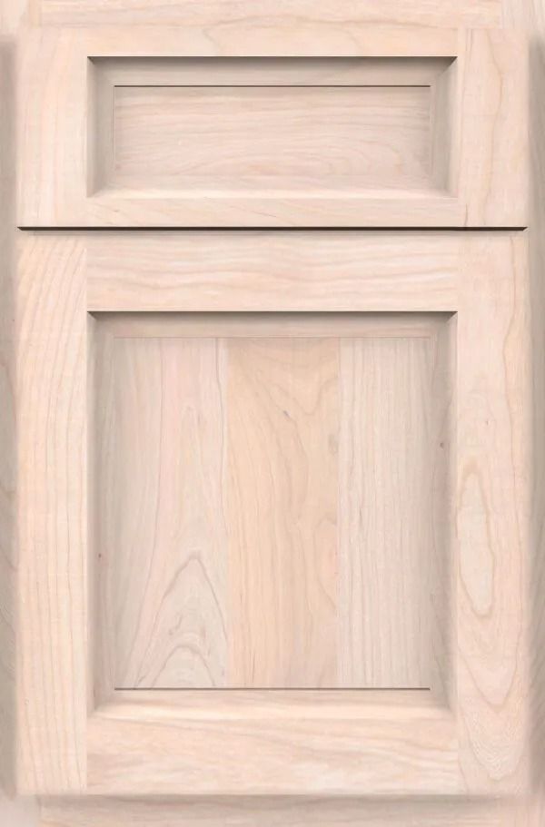 Light wood cabinet door with recessed panel and raised top panel.