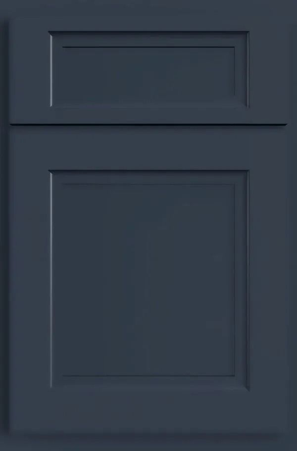 Navy blue kitchen cabinet door with raised panel design.