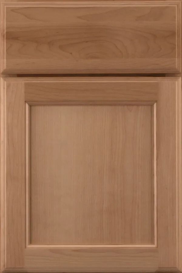 Wooden cabinet door with raised panel in a light brown stain.