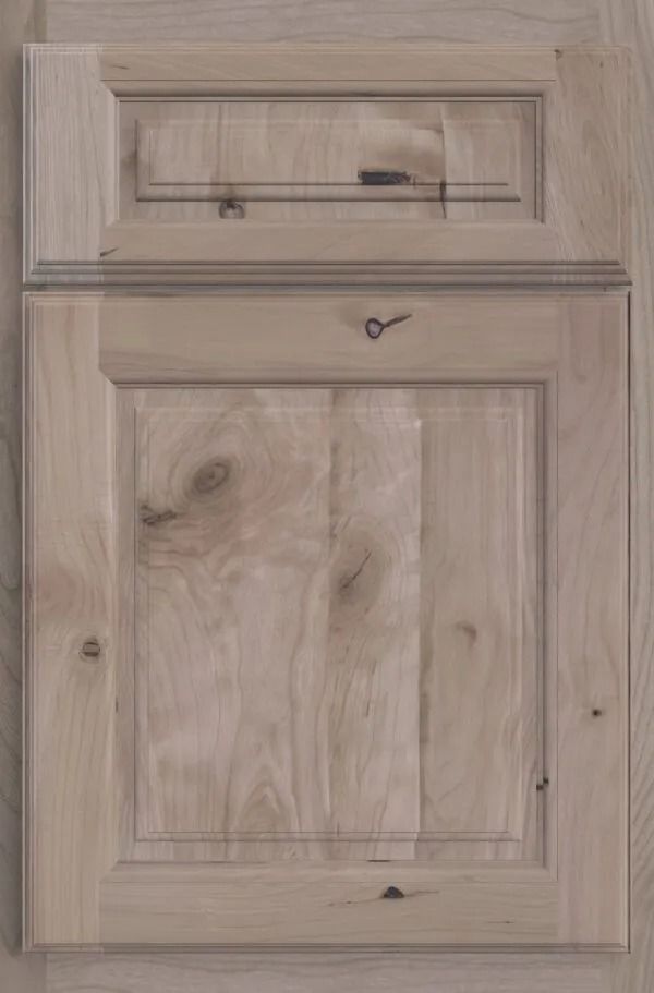 Wooden cabinet door with natural wood grain and recessed paneling.