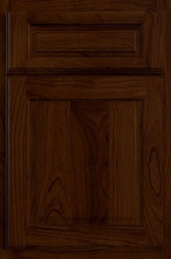 Dark brown wooden cabinet door with raised panels.