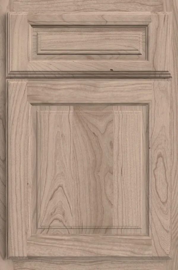 Wooden cabinet door with raised panel and top rectangular detail.