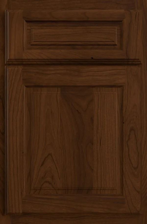 Dark brown wood cabinet door with raised panel and rectangular upper detail.