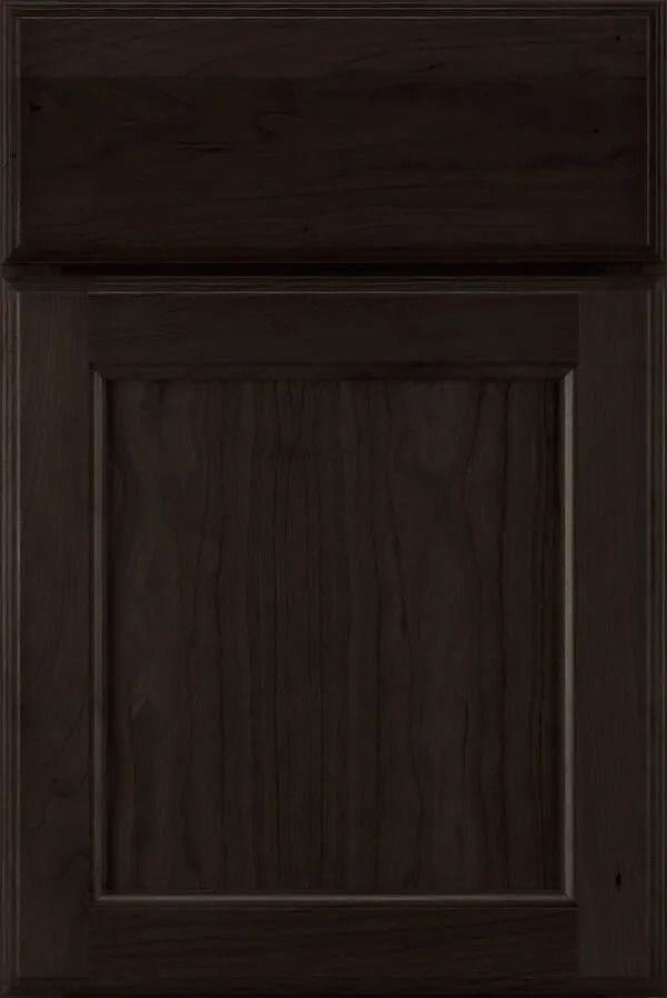 Dark brown wooden cabinet door with a recessed center panel.