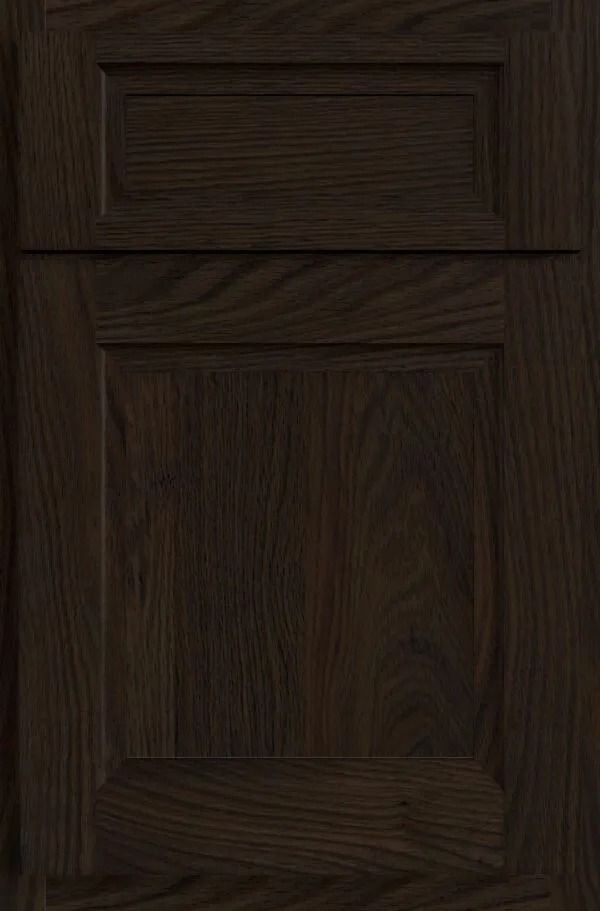 Dark brown wooden cabinet door with raised paneling and a rectangular top inset.