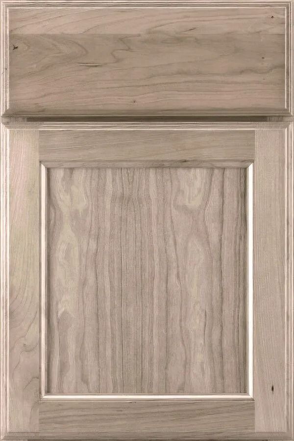 Light-colored wooden kitchen cabinet door with a raised panel and natural wood grain.