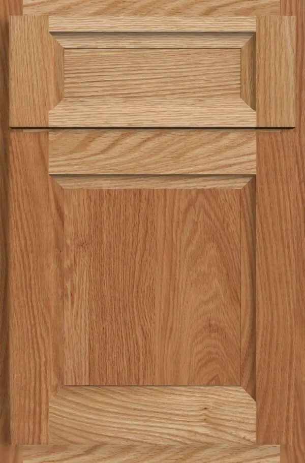 Oak cabinet door with raised panel design, stained light brown.