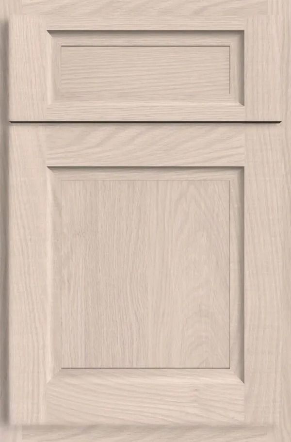 Light-colored wood kitchen cabinet door with a raised panel.