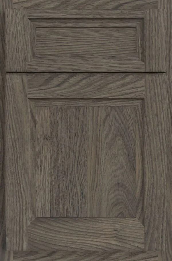 Gray wood cabinet door with raised panel and rectangular upper inset.