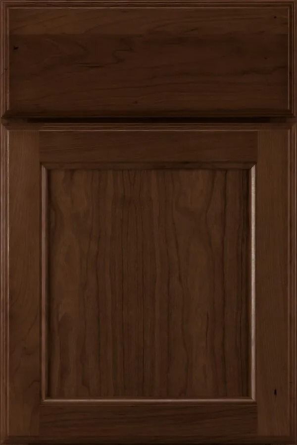 Dark brown wooden cabinet door with a raised panel.