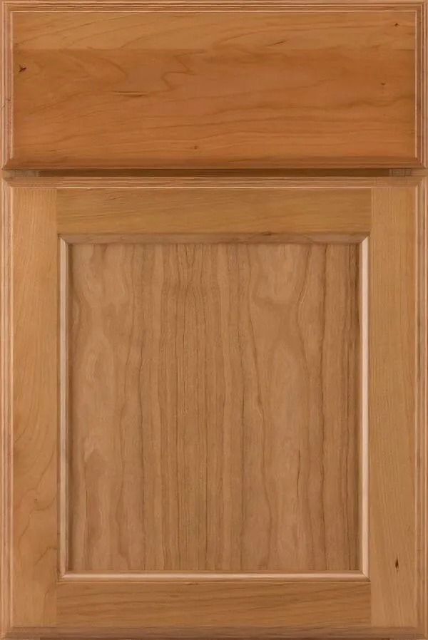 Wooden cabinet door with a raised panel and natural finish.