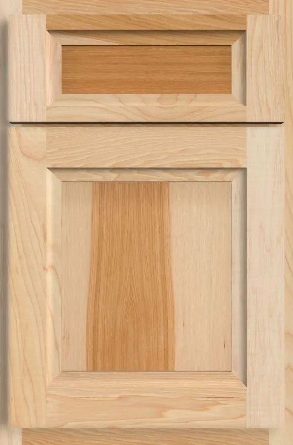 Wooden cabinet door with inset panel, natural wood grain.