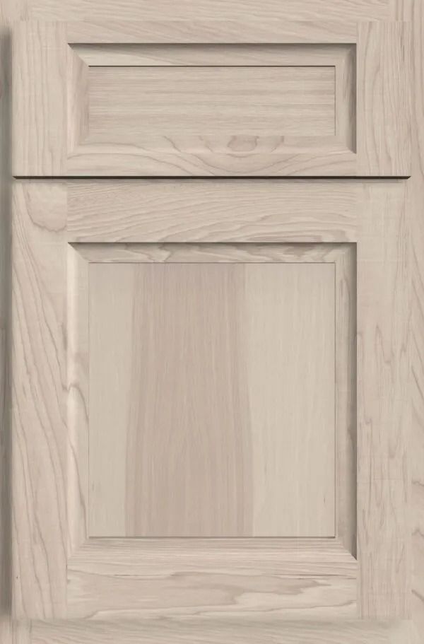 Light-colored wooden cabinet door with raised panel and rectangular upper section.