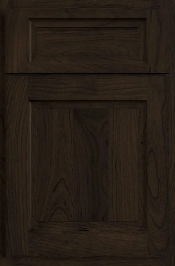 Dark brown, wooden cabinet door with raised panel and rectangular details.