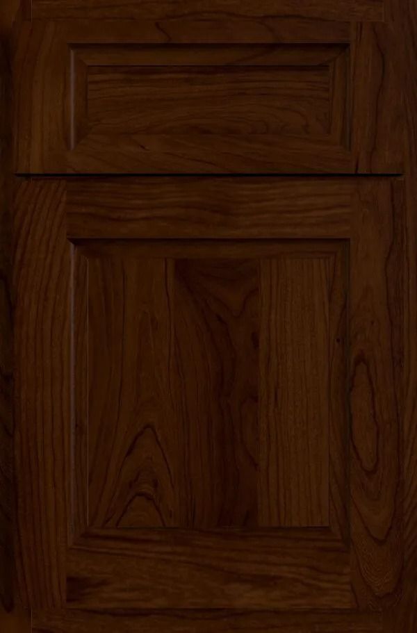 Dark stained wood cabinet door with raised panel.