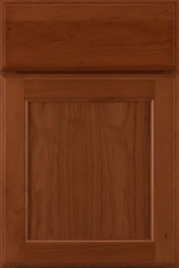 Brown wooden kitchen cabinet door with raised paneling.